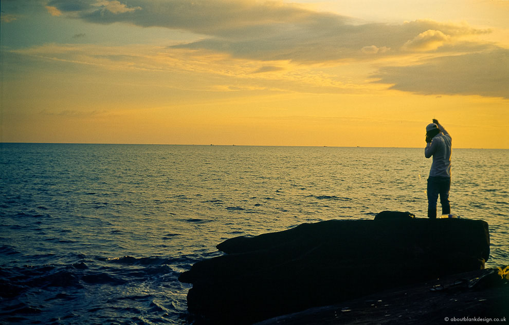 #51 fishing on the phone and in the sunset