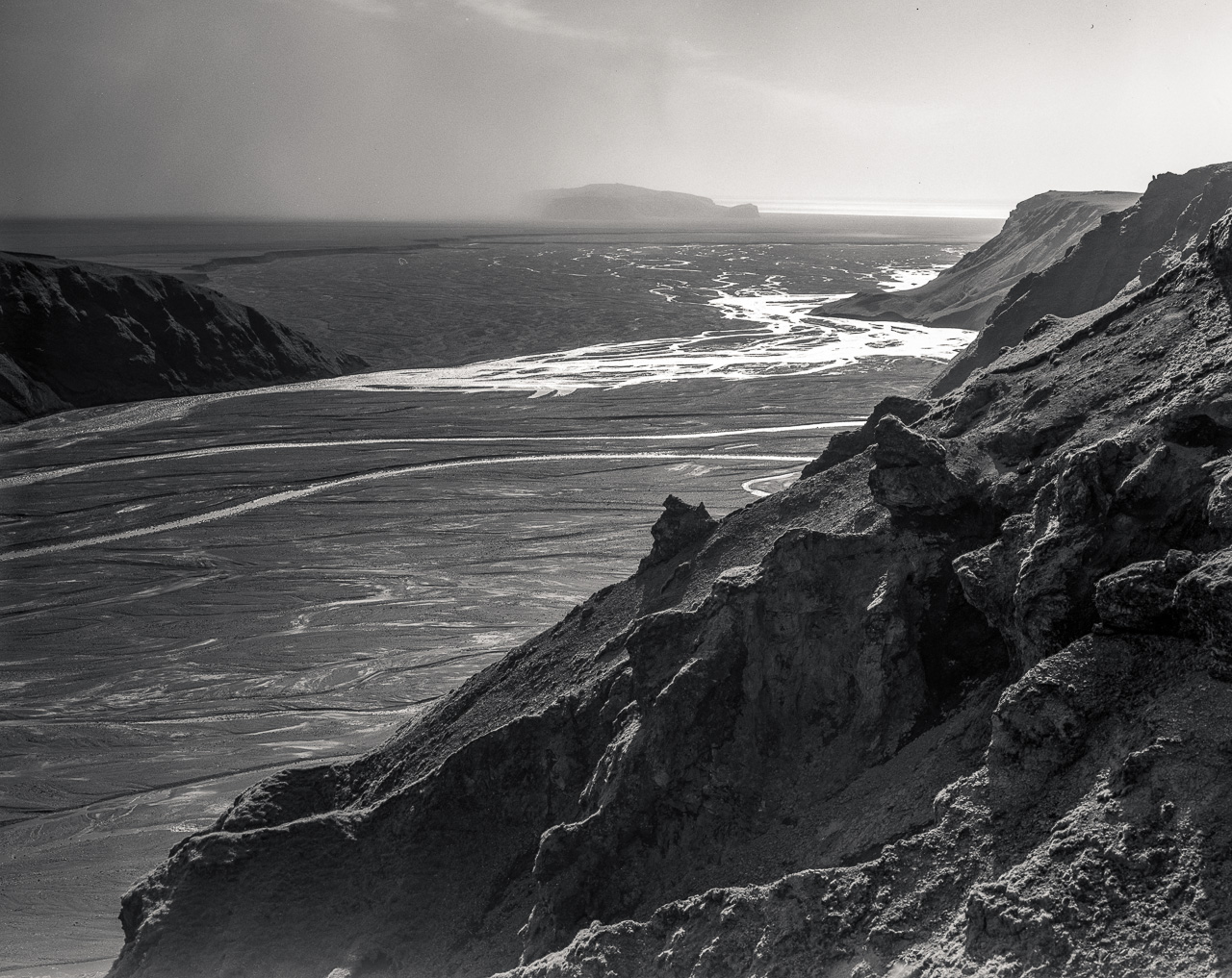 #18 what isn't covered in moss is likely blown around by some solid beach side gusts. you can see one approaching the little island from the left - it was invisible the next minute.
