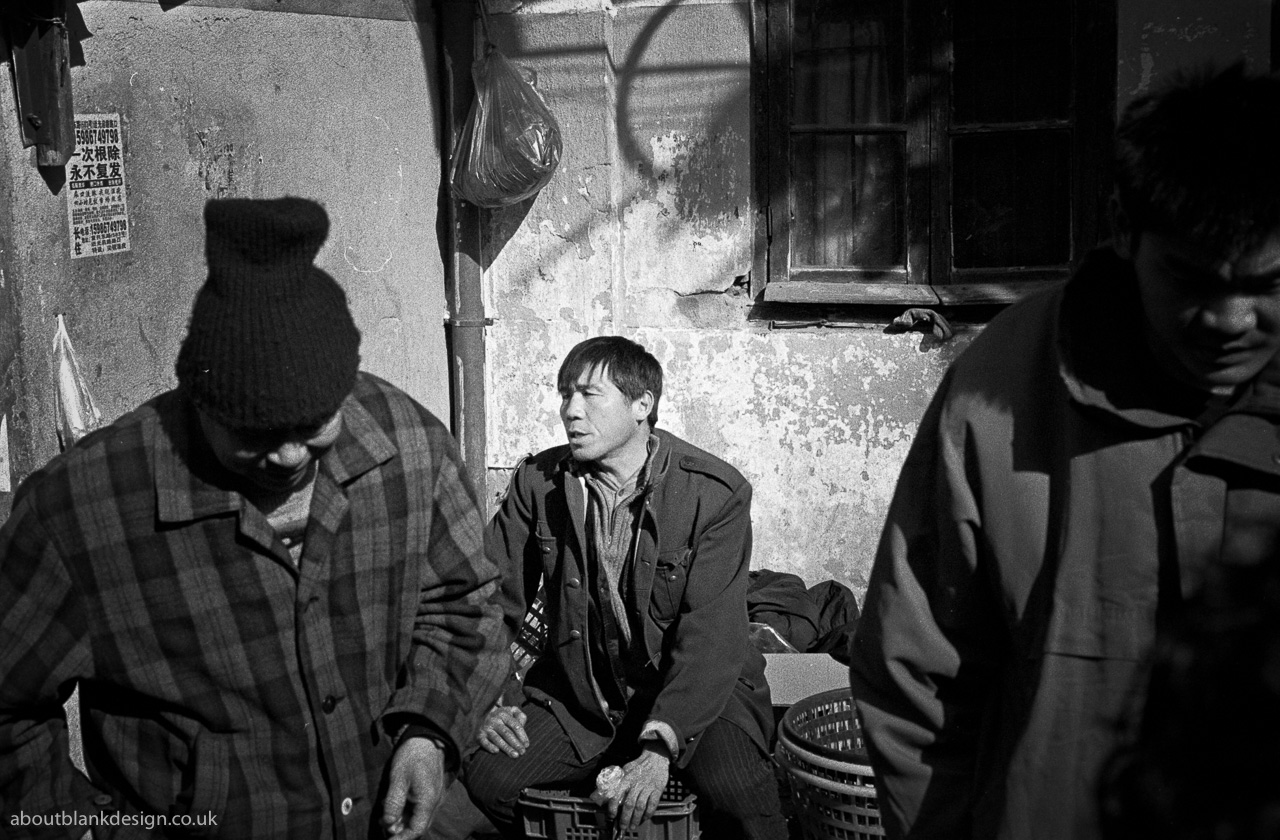 #27 Salesman at a still active street market.