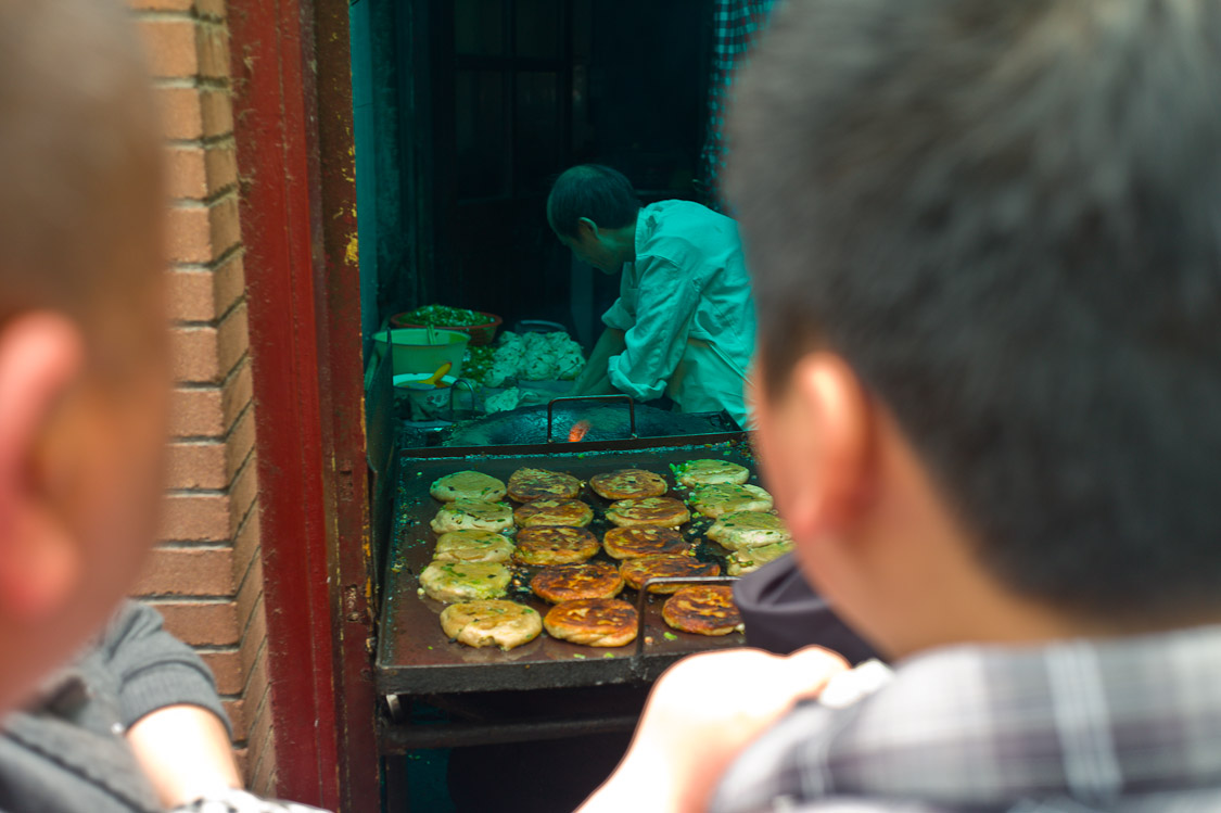 #46 this guy has a little roadside kitchen on nanchang lu - he has a queue thats monumental. seriously good though.