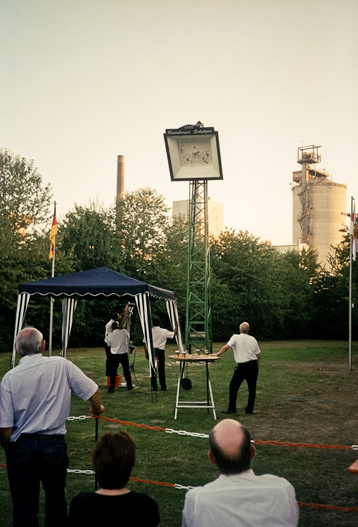 #15 they then gather round the shooting square and whoever wants tries to knock a wooden bird off a pole.