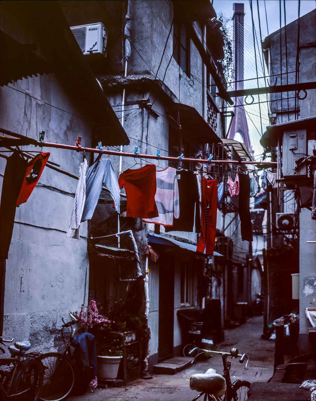#31 i took a little excursion to the north. I wanted to take a photo of a neighborhood with the gigantic Yangpu bridge. I messed up the development on this photo but it's still an interesting view I think. The bridge is massive - the pylon is the background is 223m tall, and the bridge spans more than eight kilometers.