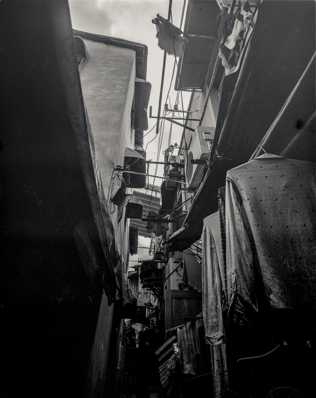 #32 still in the same neighborhood - above the tiny alleyway you can just about see the deck of the feeder road leading to the bridge.