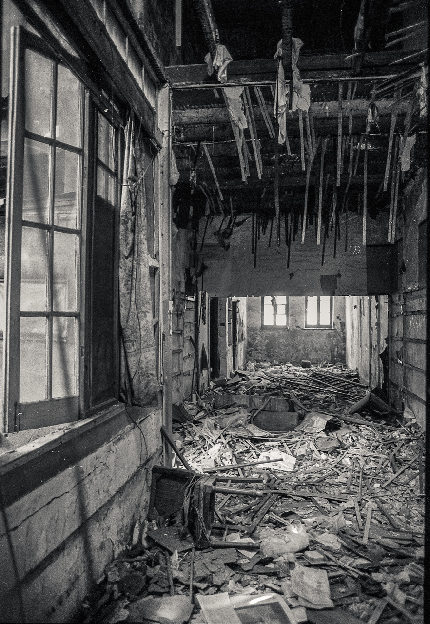 #62 Chairs, paper, and lots of wood.