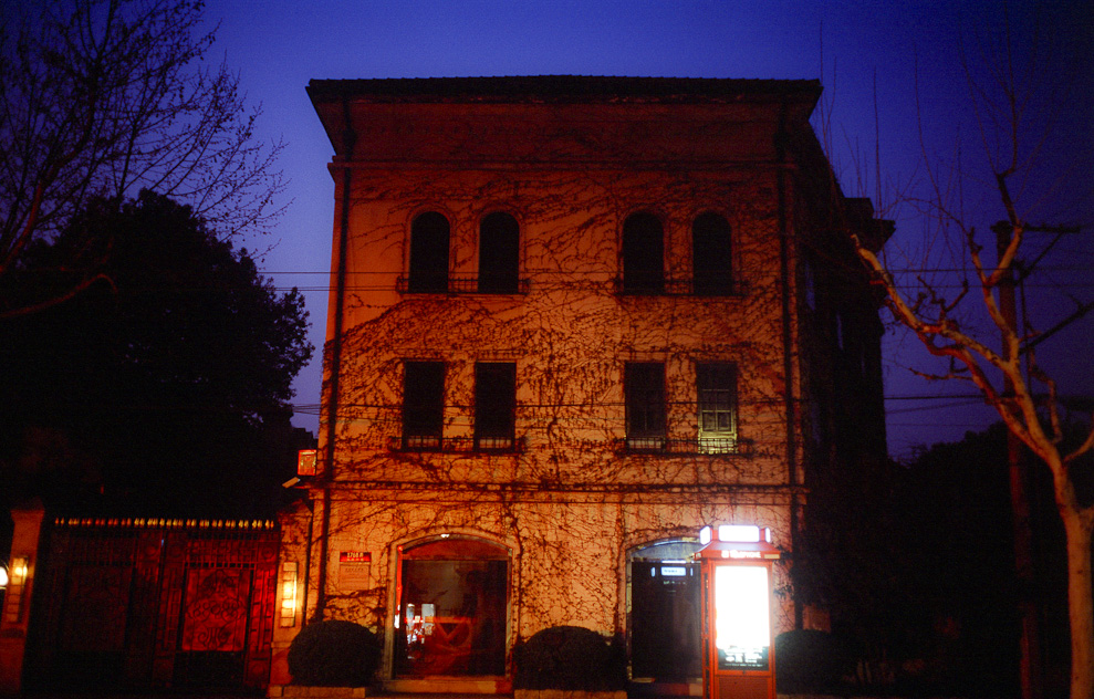 #17 house on Huaihai Lu - lit by bank adverts across the road