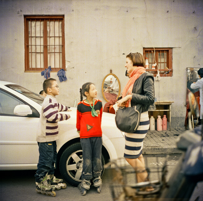 #46 Maraika having street discussions. Also with a dude getting his nose plucked in the background.