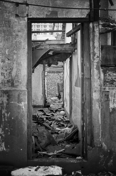 #41 a building with its core ripped out. a footie ball remains.