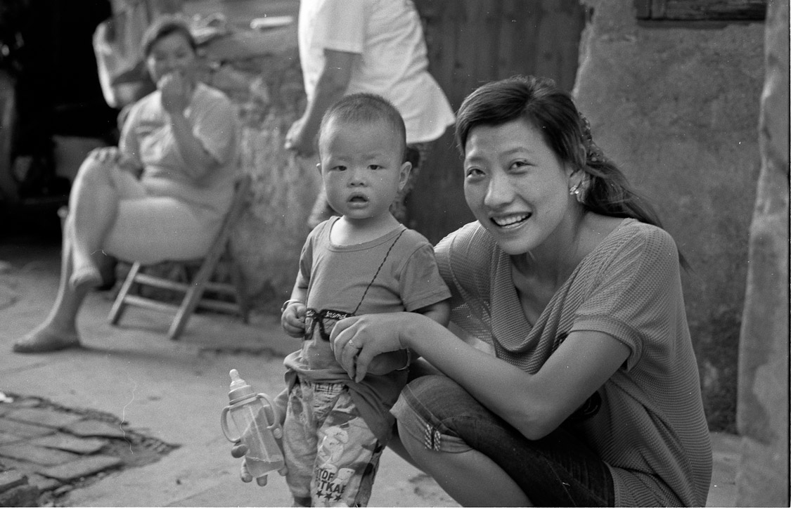 #22 around the corner, a family hanging out. Printing their pictures soon and bringing them back,