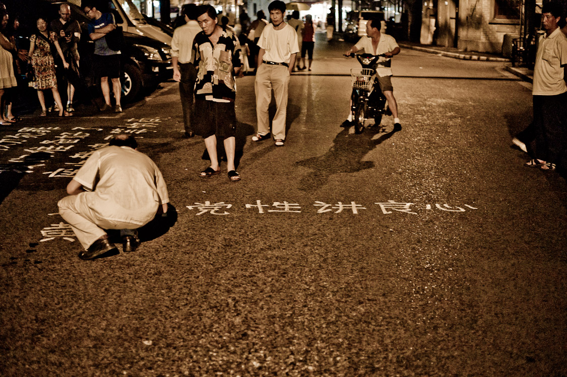#13 stencilling the street infront of the district government.