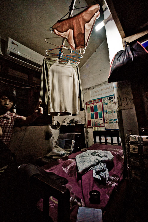 #26 This is her bedroom/ living room/ house. 5 people used to live here, she says, the house had four other families that lived in the same conditions. Now it's only her left.