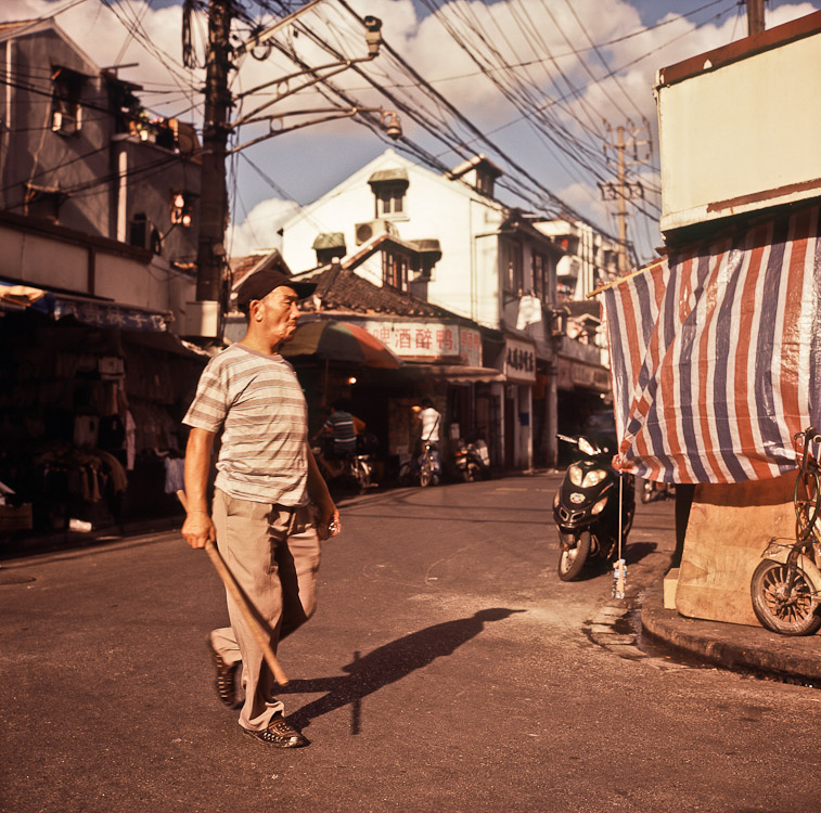 #16 Same corner, plus a man on a mission.